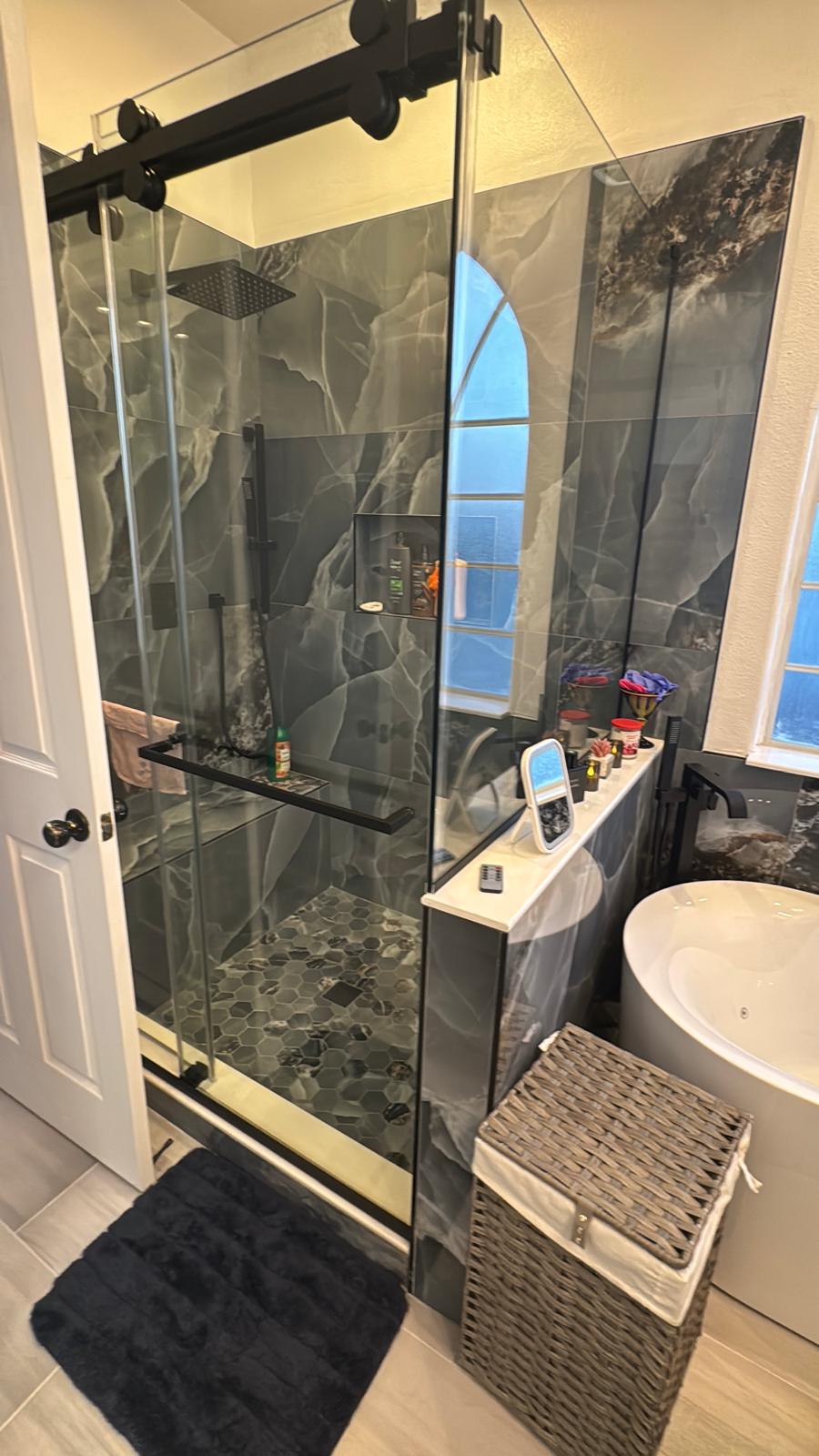 Glass shower enclosure installed by Builders and Renewals Pro